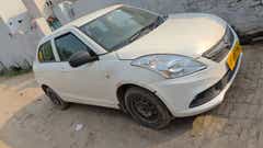 front three-quarter of a Arctic White Maruti Suzuki Dzire 2018-2023