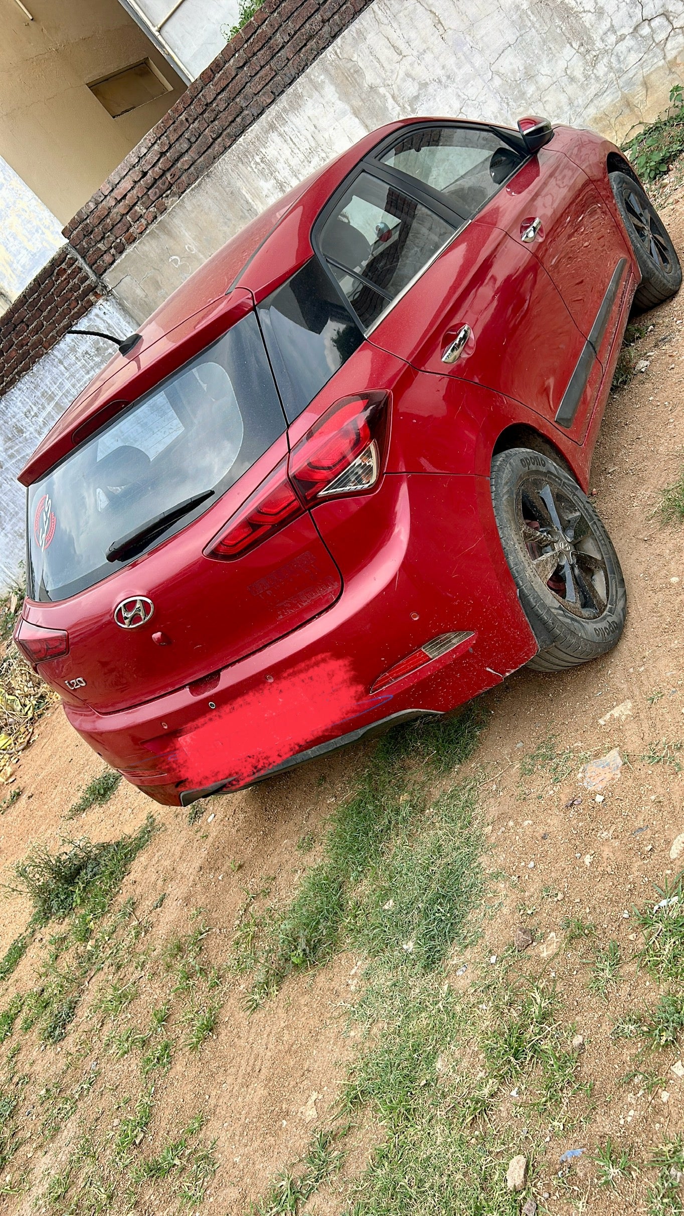 rear three-quarter of a Fiery Red Hyundai i20