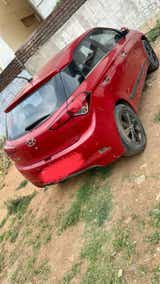 rear three-quarter of a Fiery Red Hyundai i20