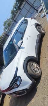 front and side view of a Kia Carens