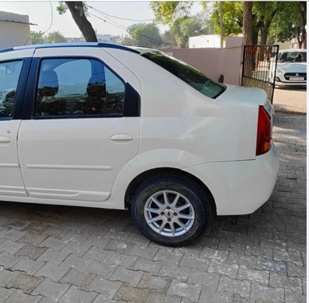 rear-side view of a Diamond White Mahindra E Verito