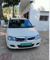 Front view of a Diamond White Mahindra E Verito