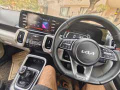 interior dashboard and steering wheel of a Kia Sonet