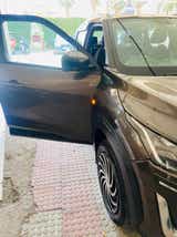 Front left side view of a Nissan Magnite with driver door open