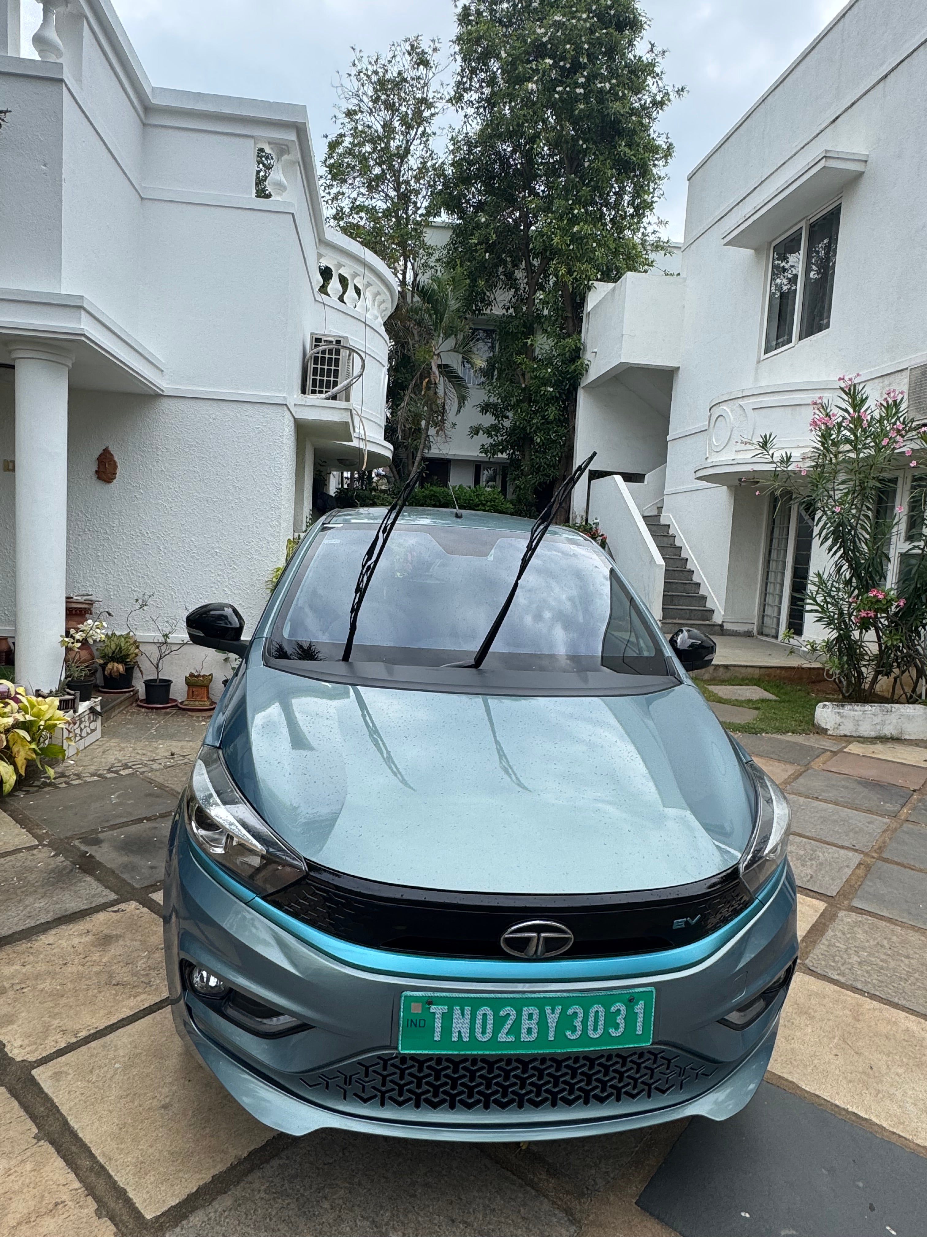 Front view of a Tata Tiago EV with wipers up