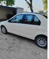 side view of a Diamond White Mahindra E Verito