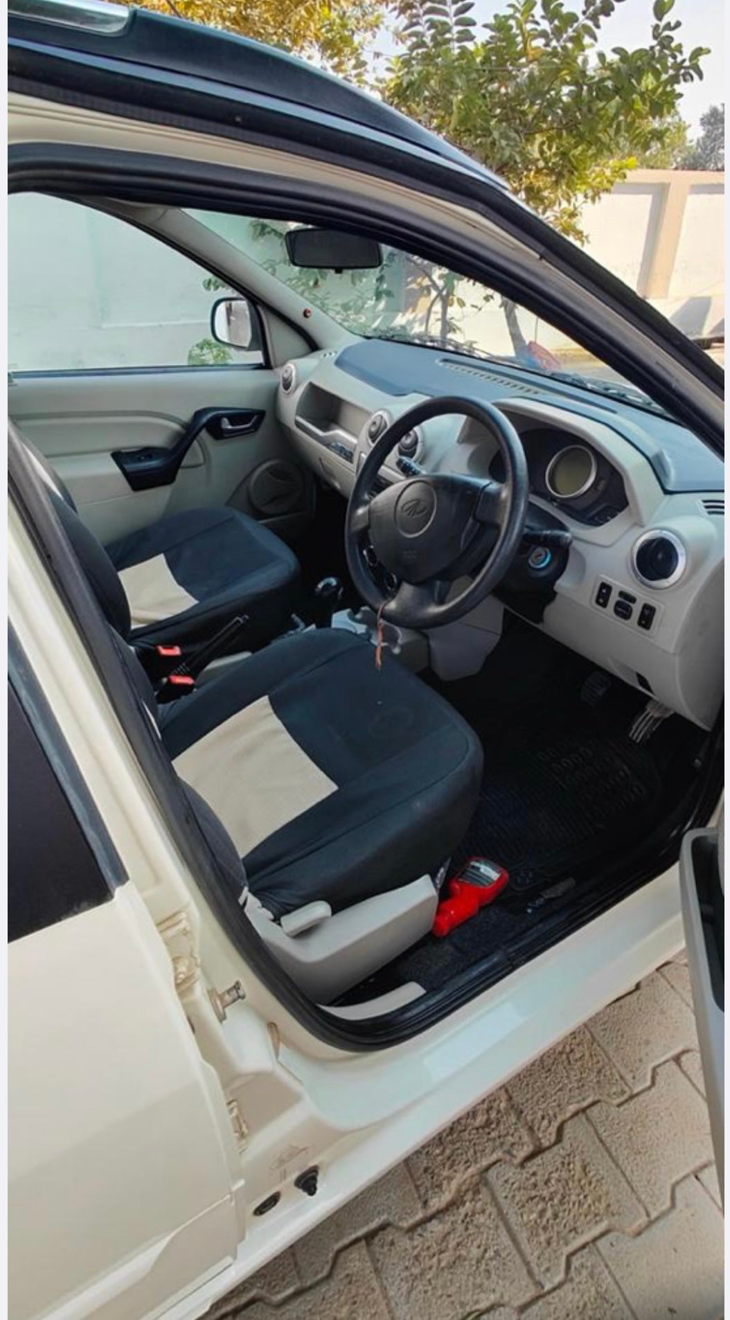Interior front seats and dashboard of a Mahindra E Verito