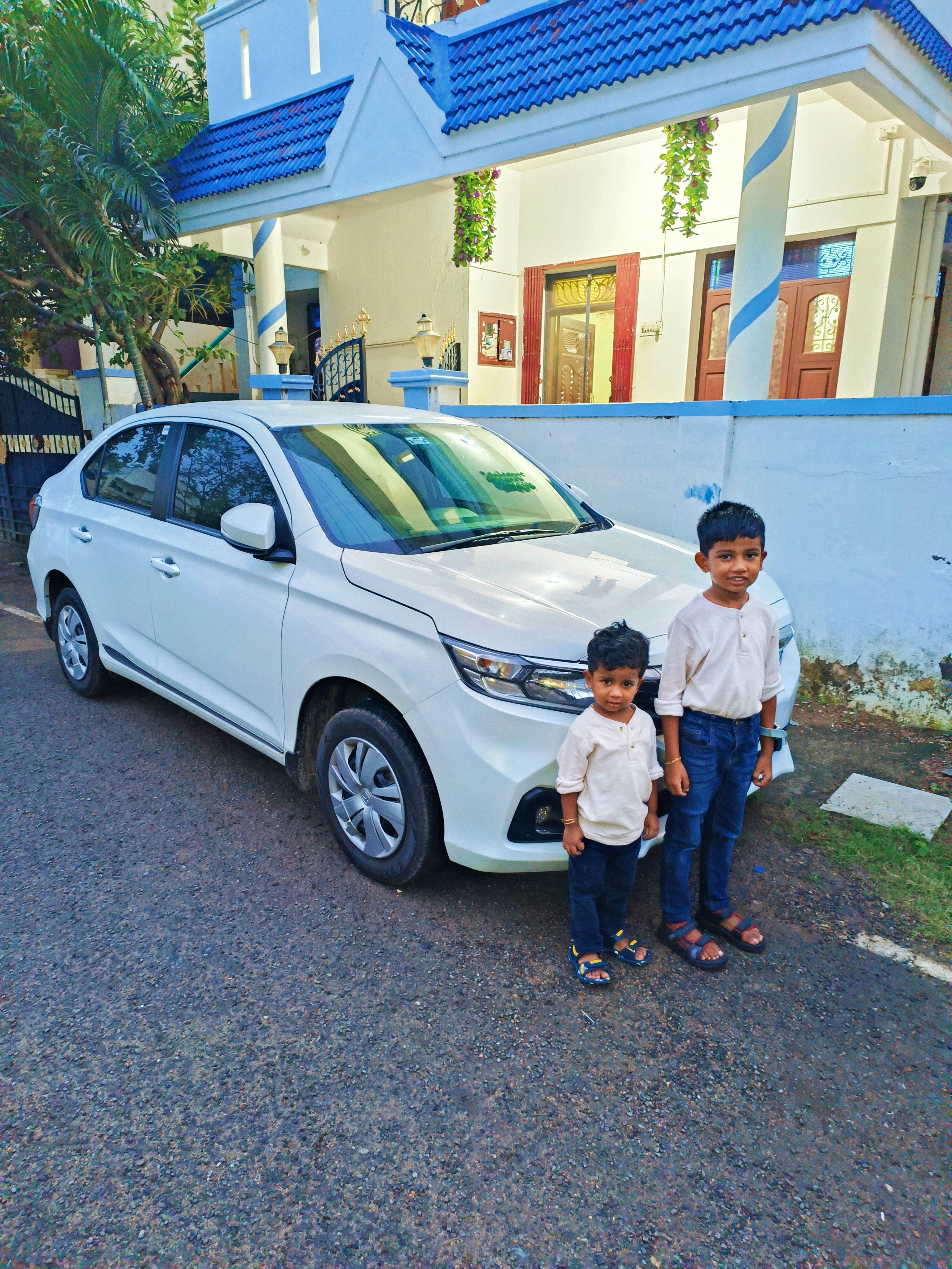 front side view of a Honda Amaze parked on a street