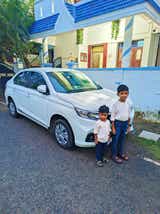 front side view of a Honda Amaze parked on a street