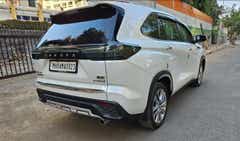 Rear three-quarter of a Toyota Innova Hycross ZX.