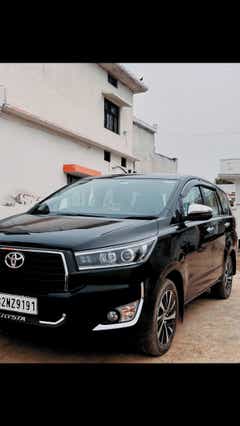 front three-quarter of a Attitude Black Toyota Innova Crysta
