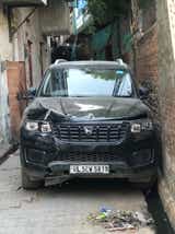 Front view of a Mahindra Scorpio-N in a narrow alley