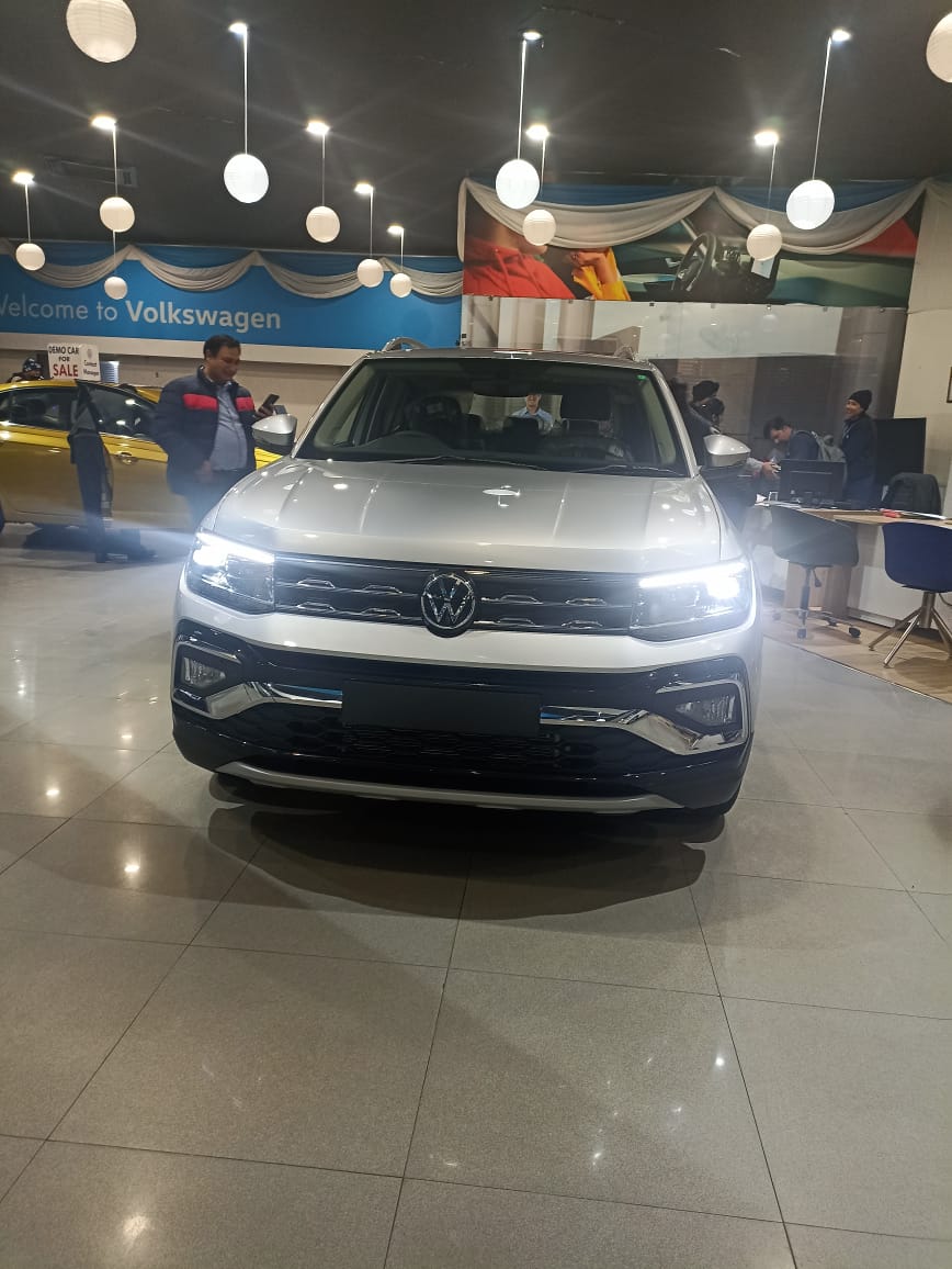 Front view of a Volkswagen Taigun displayed in showroom
