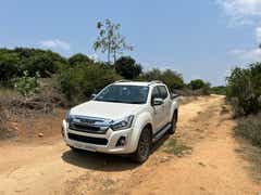 front three-quarter view of a Splash White Isuzu V-Cross
