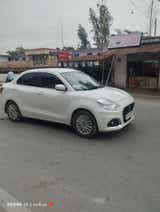 side view of a Arctic White Maruti Suzuki Dzire 2018-2023