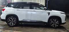 side view of a Dual Tone White & Black MG Hector Plus