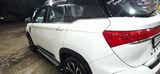 Rear three-quarter of a Dual Tone White & Black MG Hector Plus