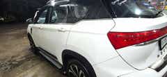 Rear three-quarter of a Dual Tone White & Black MG Hector Plus