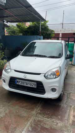 Front view of a Solid White Maruti Suzuki Alto