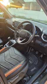 Interior dashboard and steering wheel view of a Hyundai Venue