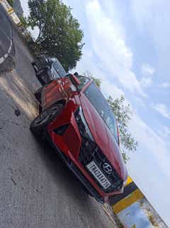 front three-quarter view of a Fiery Red Hyundai i20