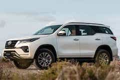 side view of a Platinum White Pearl Toyota Fortuner Legender