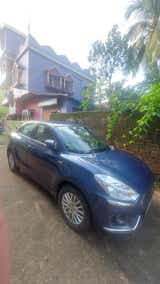 front three-quarter of a Maruti Suzuki Dzire Tour