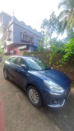 front three-quarter of a Maruti Suzuki Dzire Tour