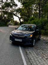 front view of a Honda Amaze 2022-2023 parked on roadside