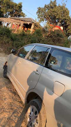 side view of a Metallic Silver Toyota Innova Hycross