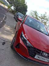 Front three-quarter view of a Fiery Red Hyundai i20
