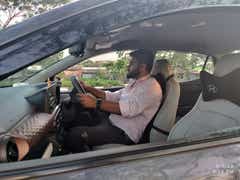 Driver-side interior view of a Hyundai Aura