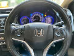 steering wheel and instrument cluster of a Honda City