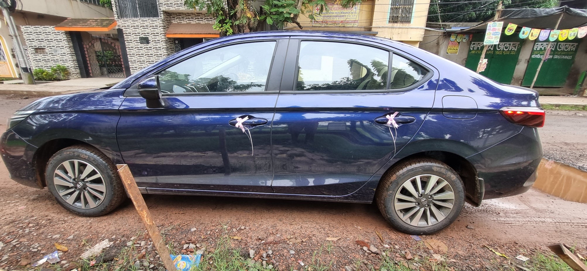 side view of a Obsidian Blue Pearl Honda City