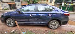 side view of a Obsidian Blue Pearl Honda City