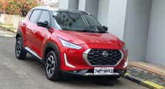 front three-quarter of a Flare Garnet Red Nissan Magnite