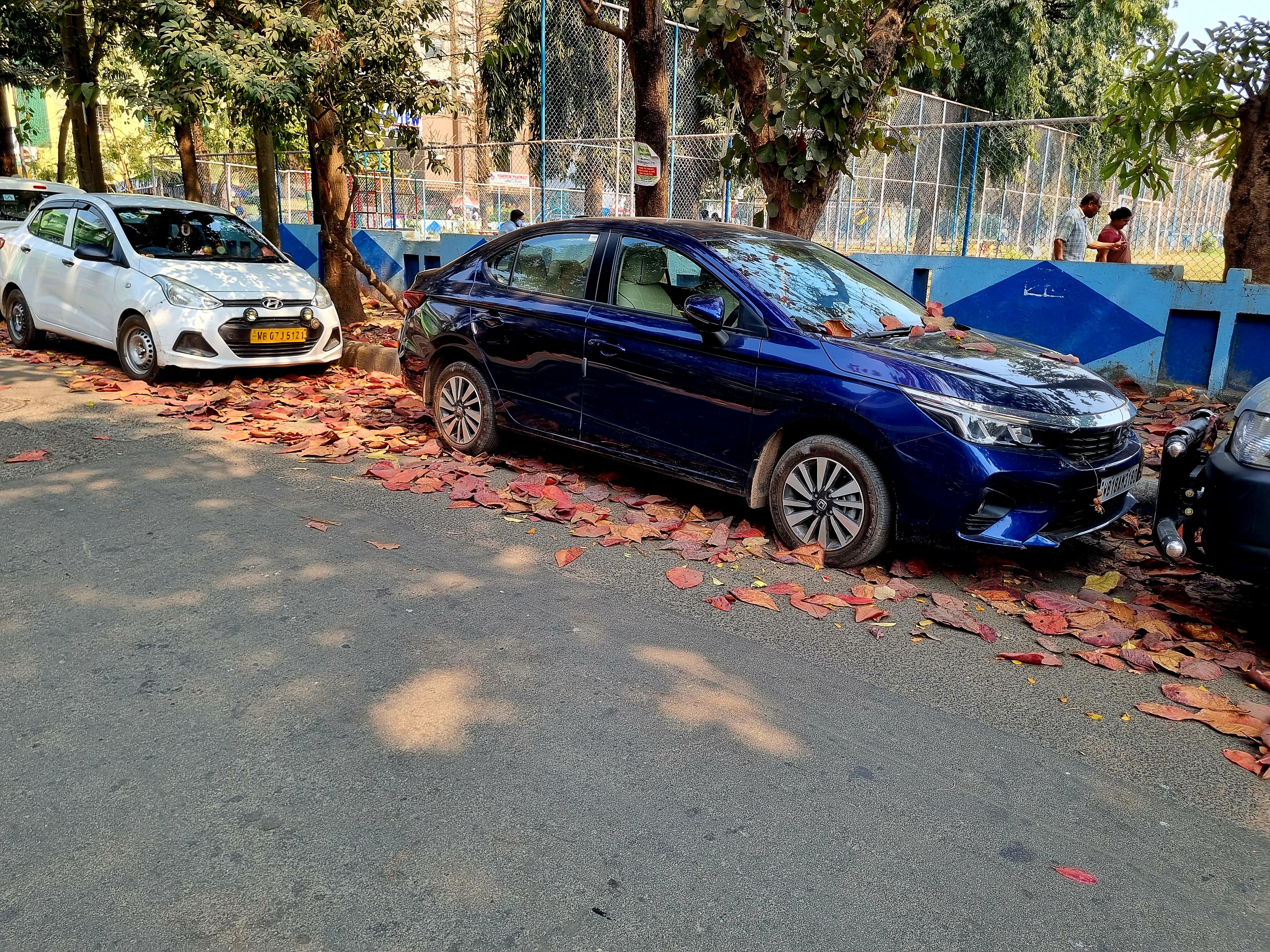 side view of a Honda City parked on a street