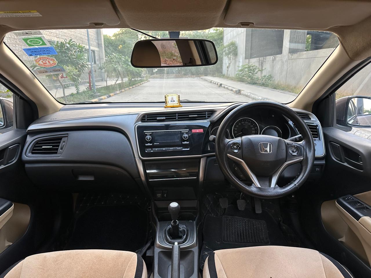 interior dashboard and steering view of a Honda City