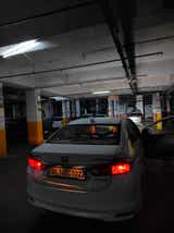 rear view of a Honda City in a parking garage