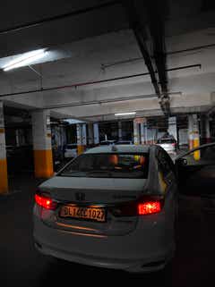 rear view of a Honda City in a parking garage