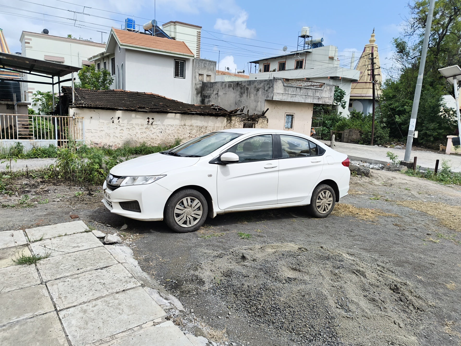 side view of a Honda City parked outdoors