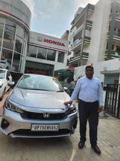 Front view of a Honda City at a Honda dealership