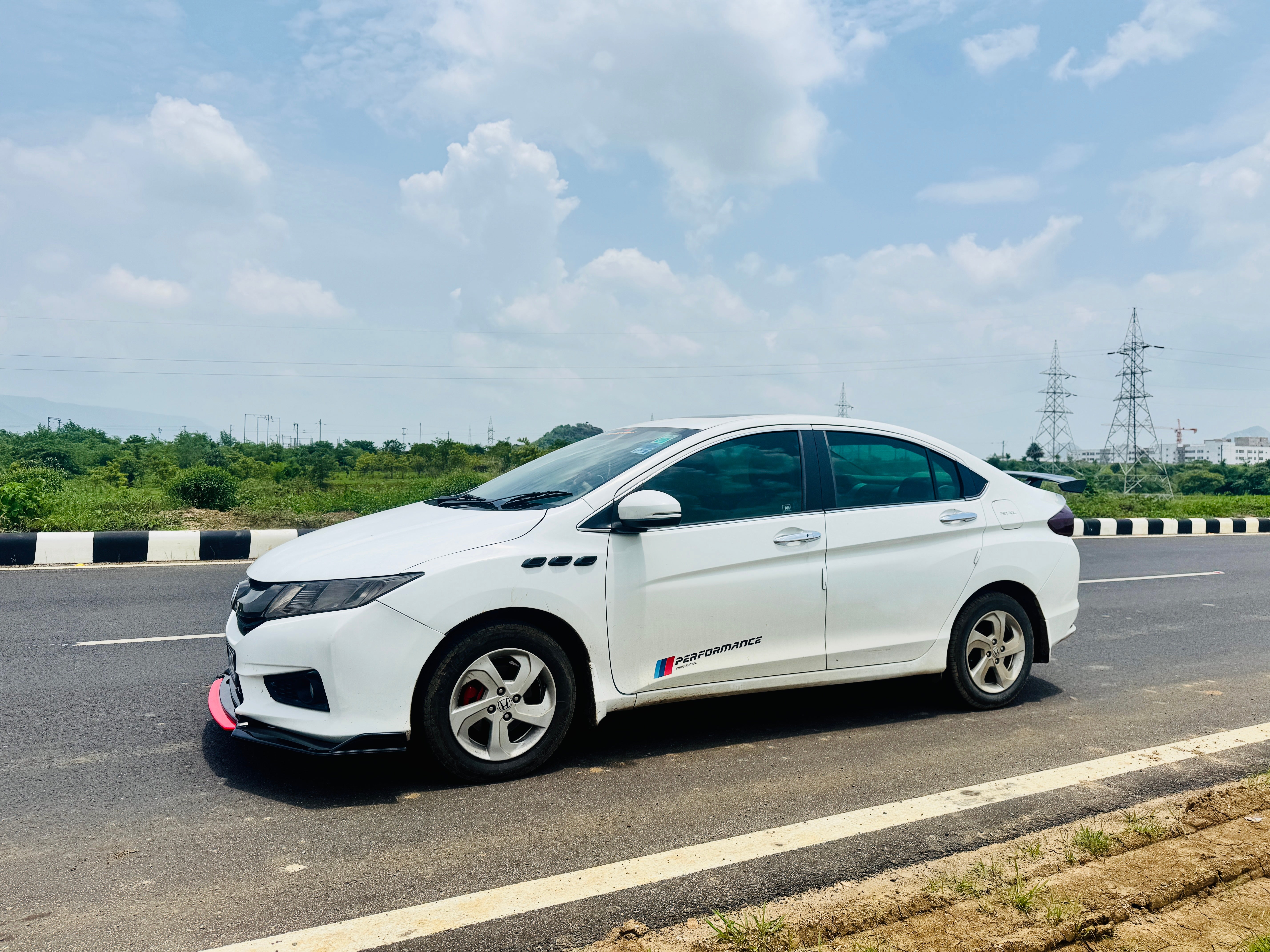 side view of a Honda City on a roadway