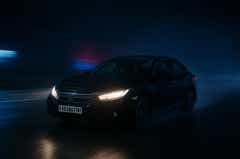 front three-quarter view of a Honda City sedan driving at night