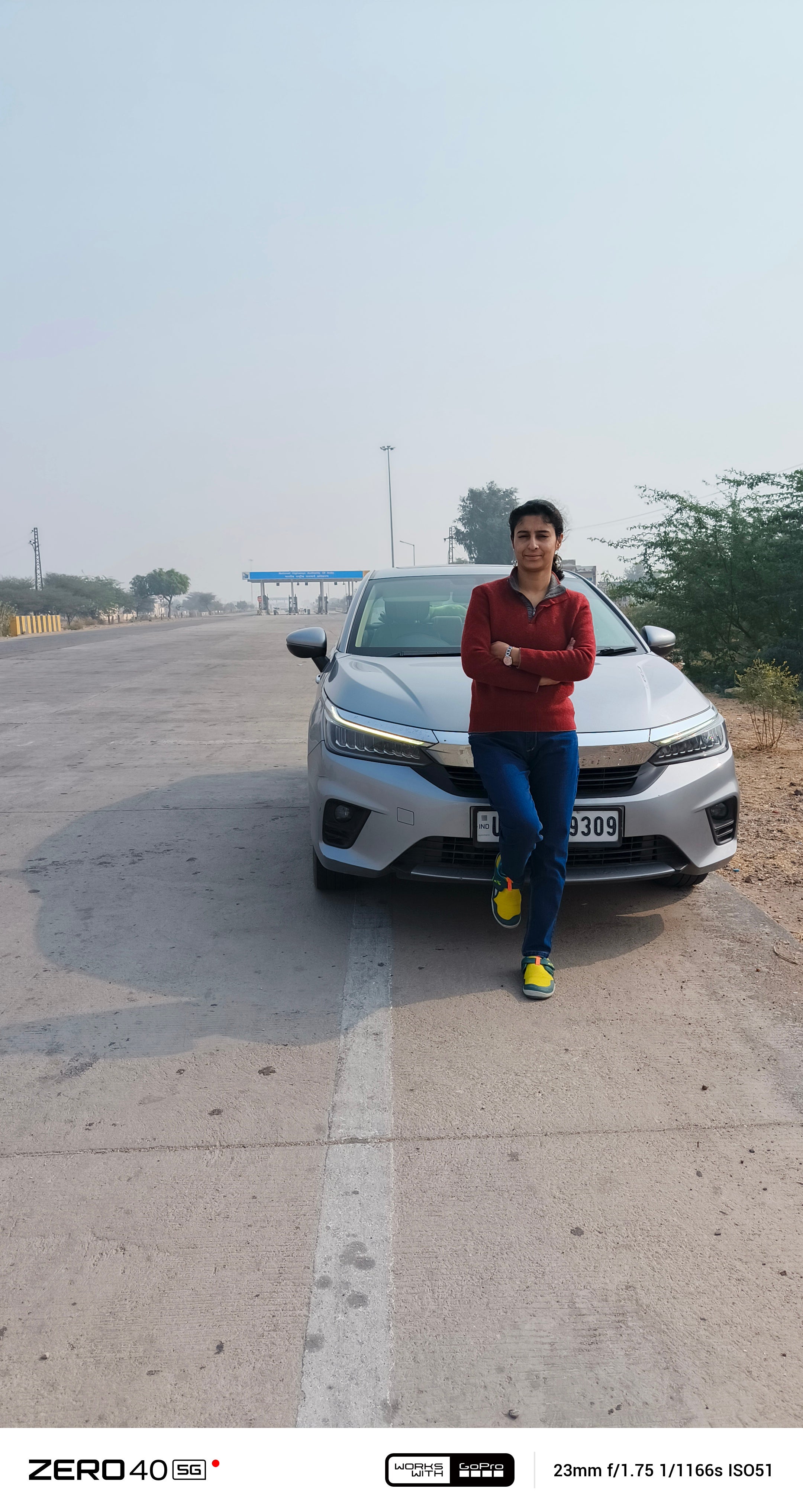 Front view of a Honda City with a person standing in front