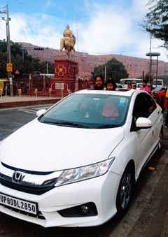 front view of a Honda City parked on the street