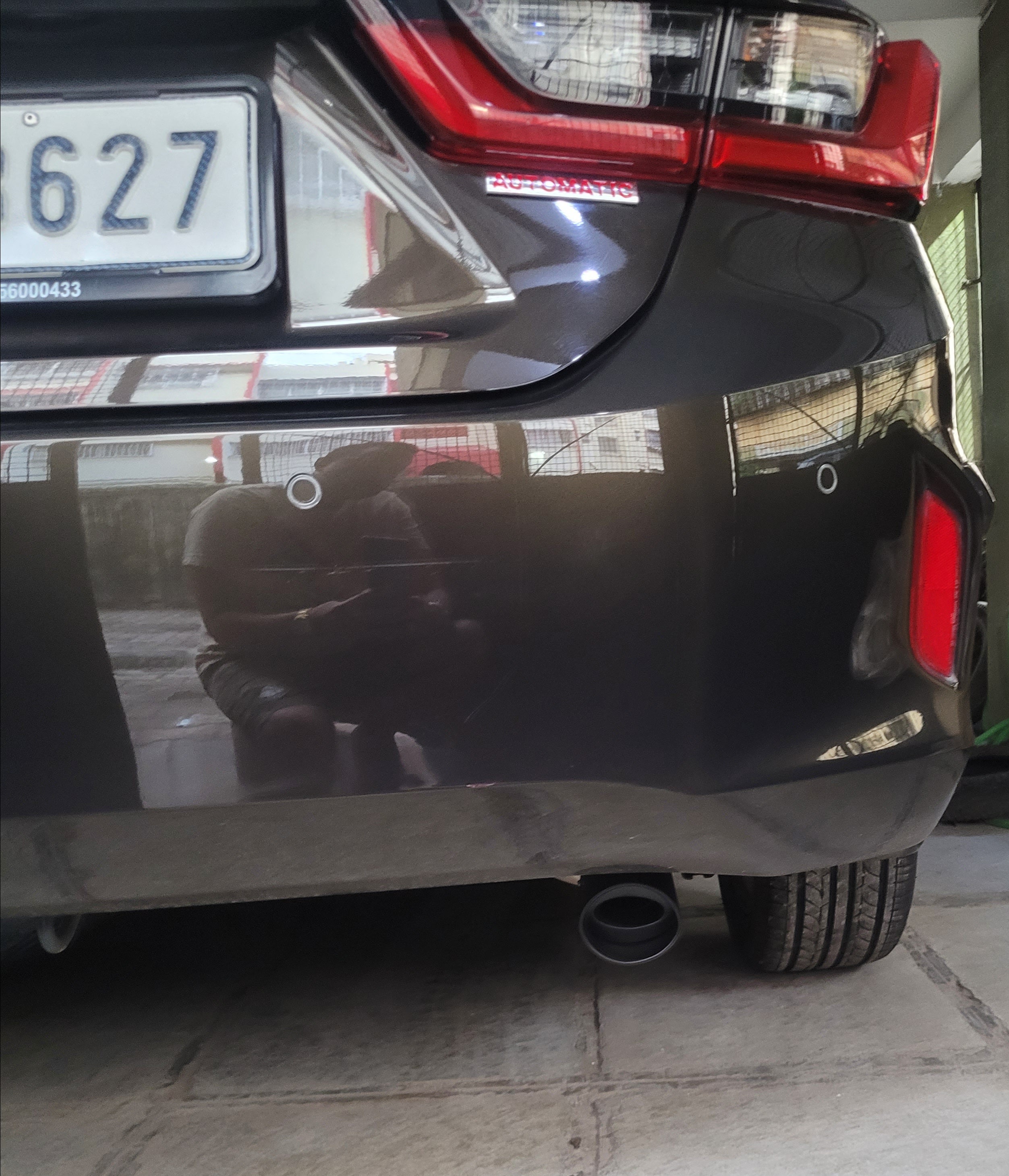 Rear bumper and tail light of a Honda City