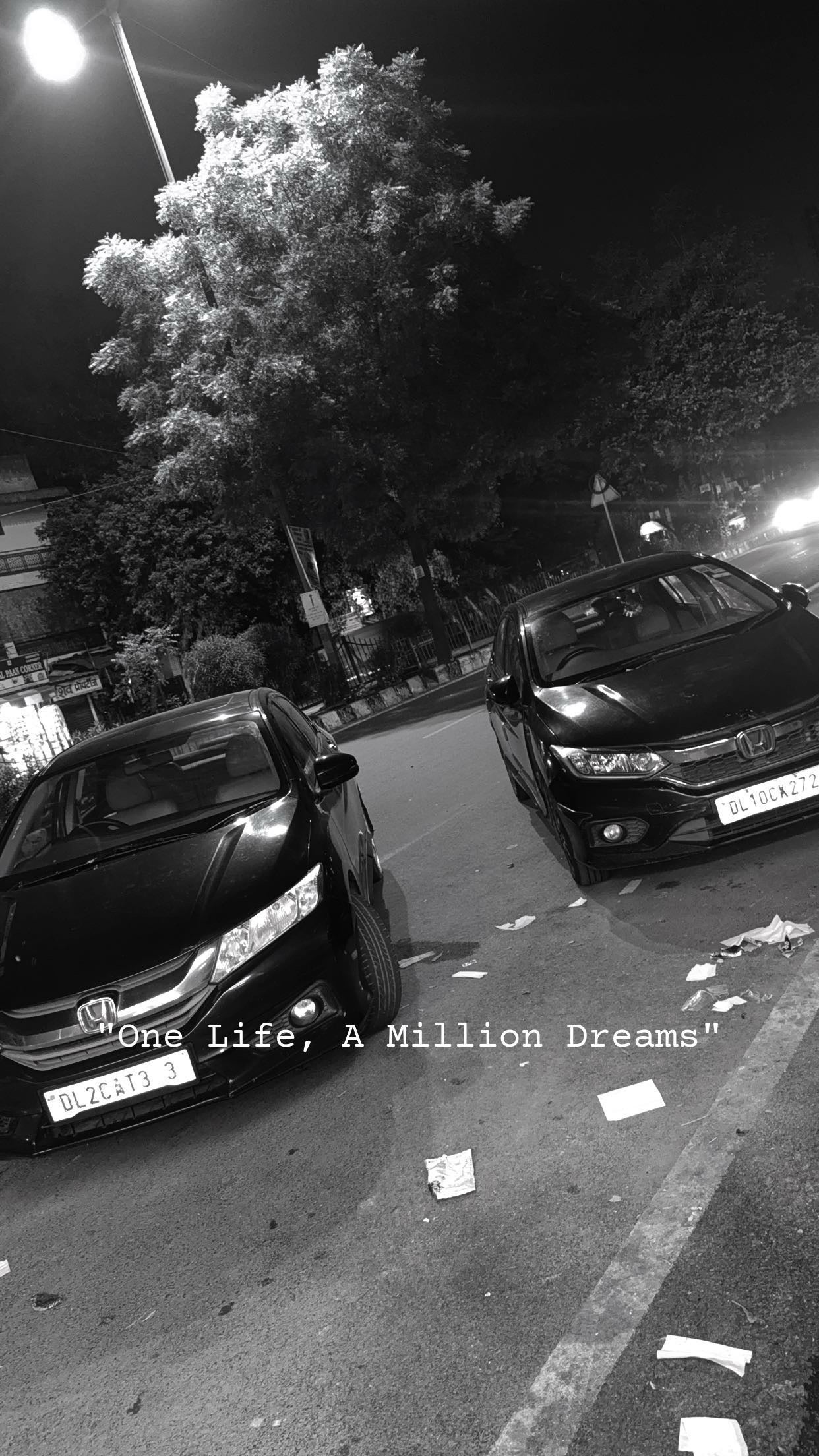 Front view of a Honda City parked on the street at night