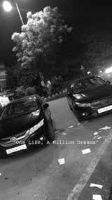 Front view of a Honda City parked on the street at night