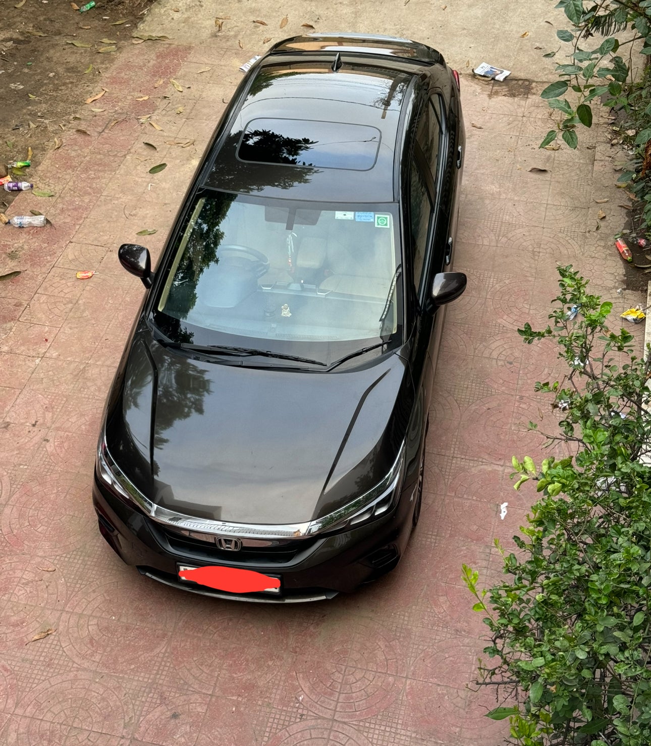 top view of a Honda City parked outdoors